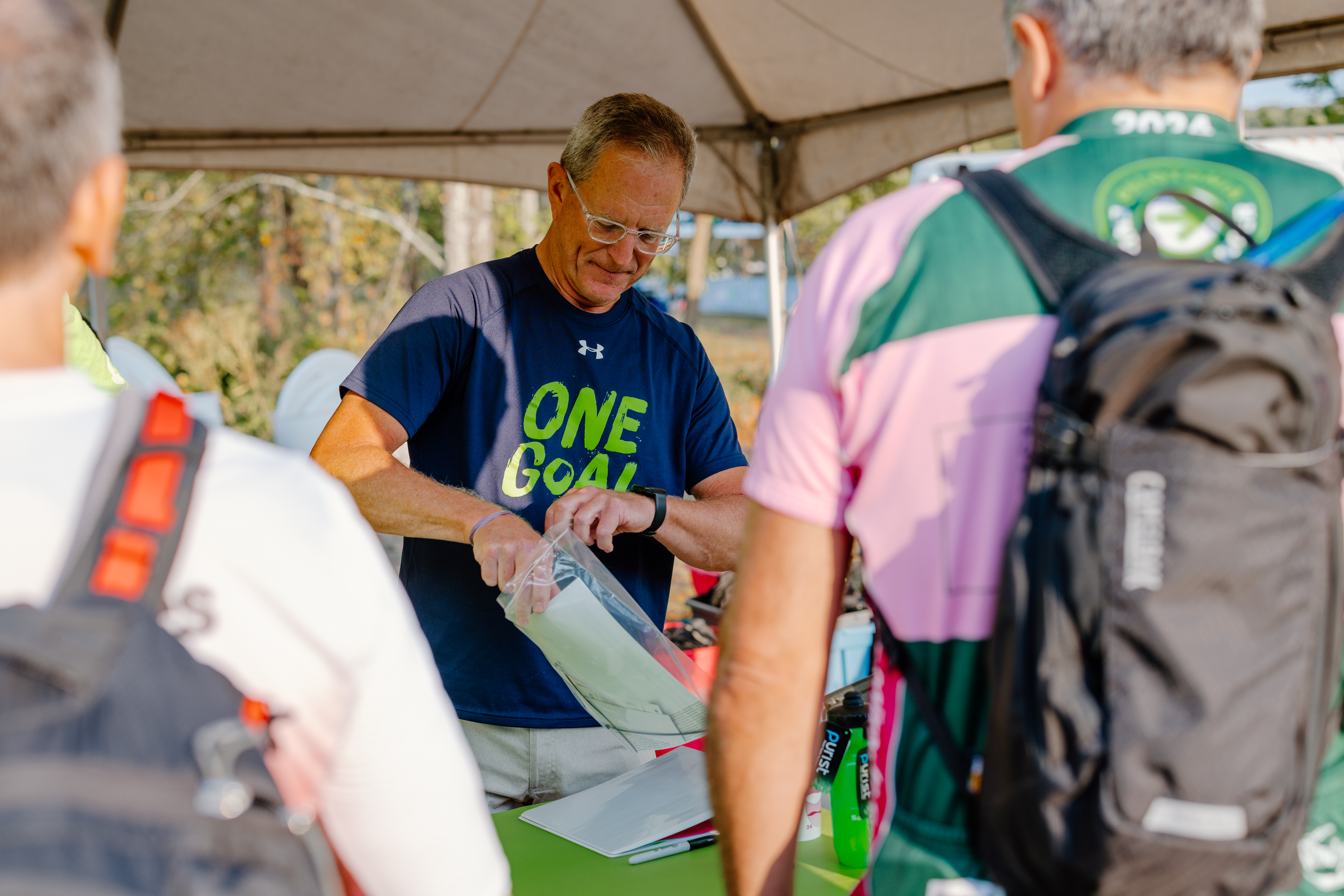Pelotonia volunteer at the One Goal tent